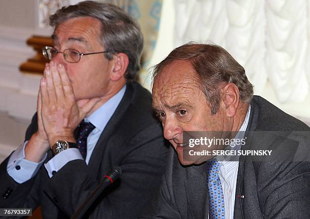 European Bank for Reconstruction and Development President Jean Lemier listens with Yves Thibault De Silguy, VINCI President during a ceremony of...