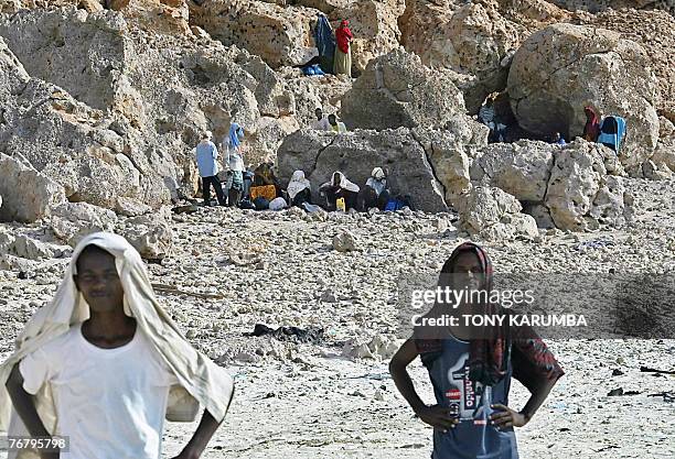 Ethiopians and Somalians wait near Shinbivale beach, 16 kilometers east of Bosasso, to be smuggled into Yemen aboard fishing vessels 07 September...