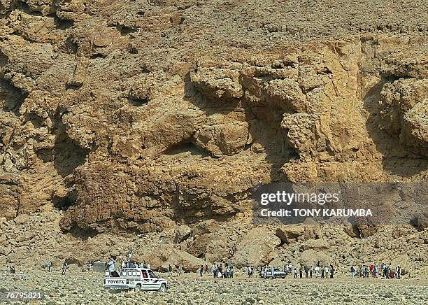 Ethiopians and Somalians wait near Shinbivale beach, 16 kilometers east of Bosasso, to be smuggled into Yemen aboard fishing vessels 07 September...