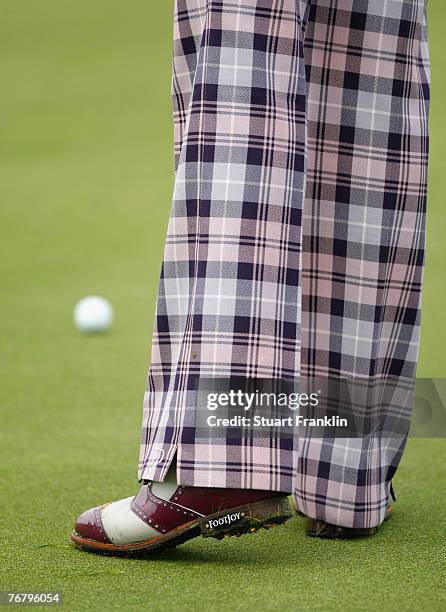 The trousers and shoes of Ian Poulter of England during the first round of The Mercedes-Benz Championship at The Gut Larchenhof Golf Club on...