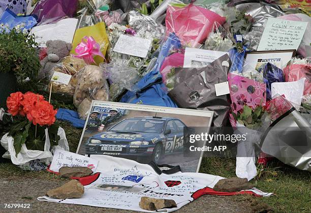 Flowers and tributes are left outside the home of former rally world champion Colin McRae in Lanark, in Scotland, 17 September 2007. Air accident...