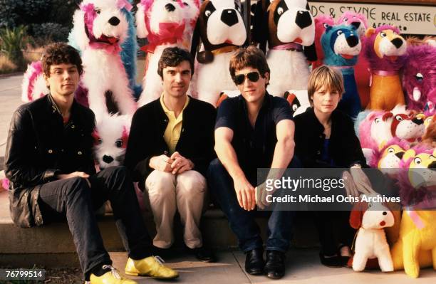 Jerry Harrison, David Byrne, Chris Frantz, and Tina Weymouth of the Talking Heads pose for a portrait in front of stuffed animals in December 1977 in...