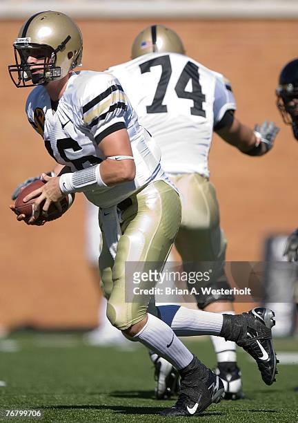Quarterback Carson Williams of the Army Black Knights scrambles out of the pocket against the Wake Forest Demon Deacons during the Black Knights...