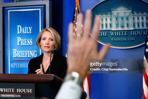 Dana Perino, the new Press Secretary President for George W. Bush, takes questions from the White House press corps during her first day September...