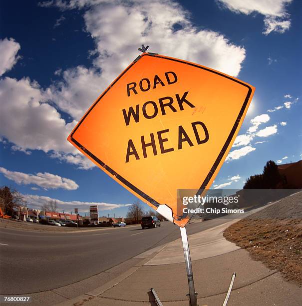 road work ahead sign - señal-de-obras-en-la-vía fotografías e imágenes de stock