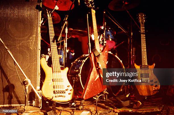 electric guitars on stage with equipment - guitar stand stock pictures, royalty-free photos & images