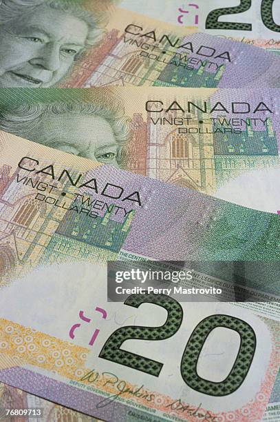 canadian twenty dollar bank notes - twenty canadian dollar note stock pictures, royalty-free photos & images