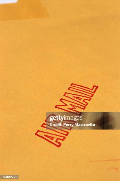 air mail stamp on manila envelope - manila envelope stock pictures, royalty-free photos & images