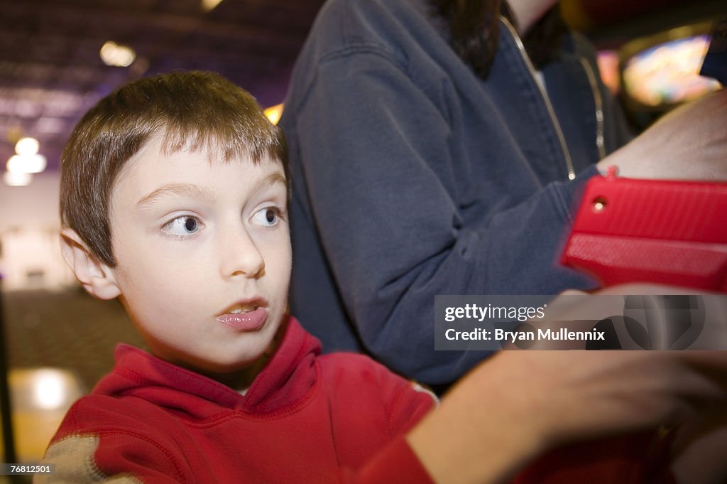 Boy in video arcade