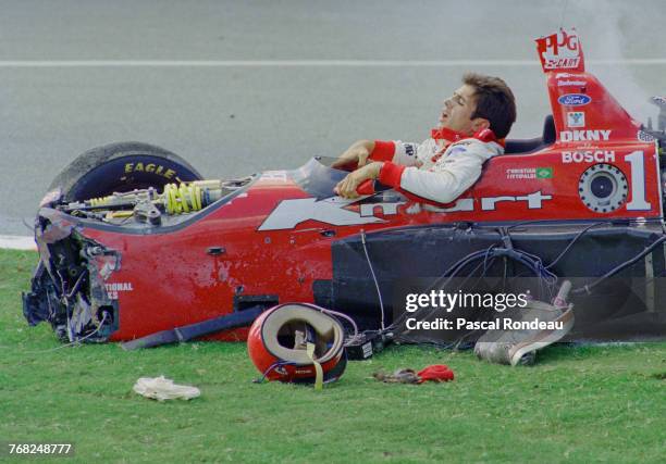 Christian Fittipaldi of Brazil attempts to climb out of the Newman-Haas RacingSwift 007i Ford XD following his crash during the Championship Auto...
