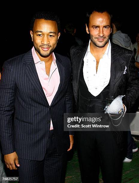 Musician John Legend and fashion designer Tom Ford attend "Greeting Card" by artist Aaron Young at the Park Avenue Armory on September 17, 2007 in...