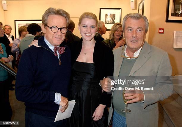John Swannell with his daughter and Terry O'Neil attend the private view of 'Terence Donovan: Image Maker And Innovator', at the Chris Beetles...