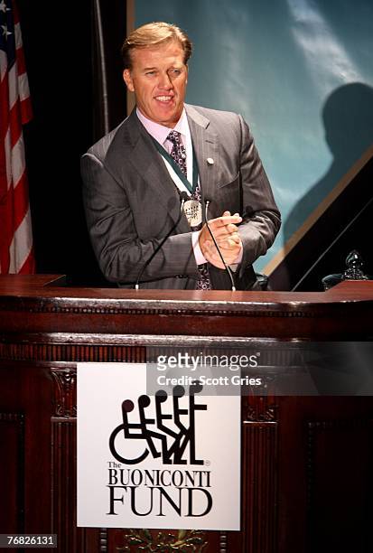 John Elway speaks at the 22nd Annual Great Sports Legends Dinner to benefit The Buoniconti Fund to Cure Paralysis at the Waldorf Astoria September...