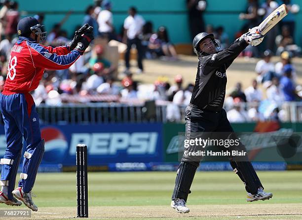 Craig McMillan of New Zealand hits to third man with Vikram Solanki of England looking on during the ICC Twenty20 Cricket World Championship Super...