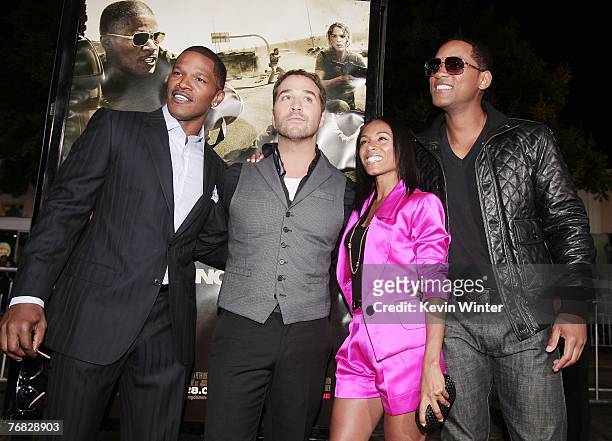 Actors Jamie Foxx, Jeremy Piven, Jada Pinkett Smith and Will Smith pose at the premiere of Universal Picture's "The Kingdom" at the Mann's Village...