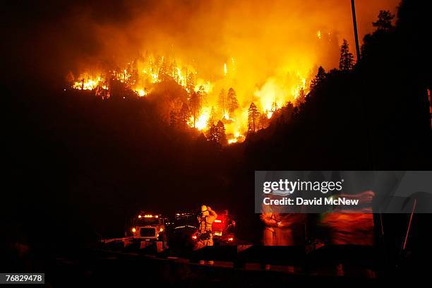 The Butler 2 Fire burns through the night on September 17, 2007 near Fawnskin, California. Earlier today, a single-engine air tanker fighting the...