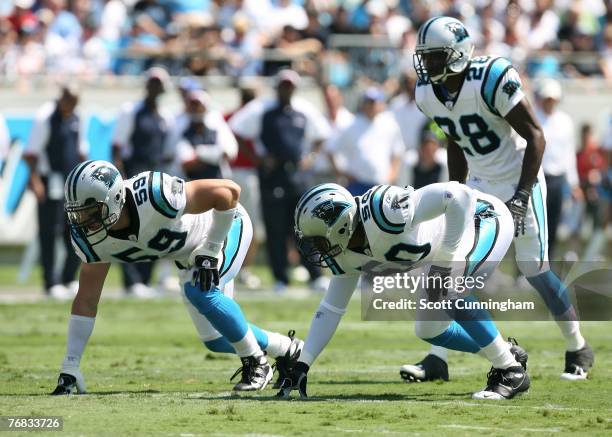 James Anderson, Adam Seward, and Quinton Teal of the Carolina Panthers line up against the Houston Texans at Bank of America Stadium on September 16,...