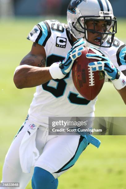 Steve Smith of the Carolina Panthers runs for a touchdown against the Houston Texans at Bank of America Stadium on September 16, 2007 in Charlotte,...