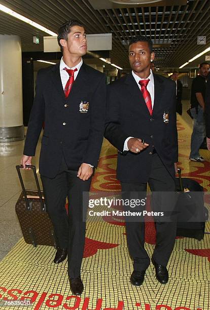 Cristiano Ronaldo and Nani of Manchester United arrive at Lisbon Airport ahead of their UEFA Champions League match against Sporting Lisbon at Jose...