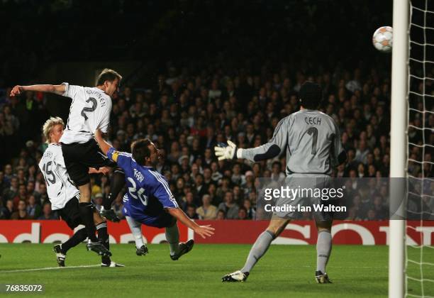 Miika Koppinen of Rosenborg beats John Terry of Chelsea to shoot past Petr Cech to score their first goal during the UEFA Champions League Group B...