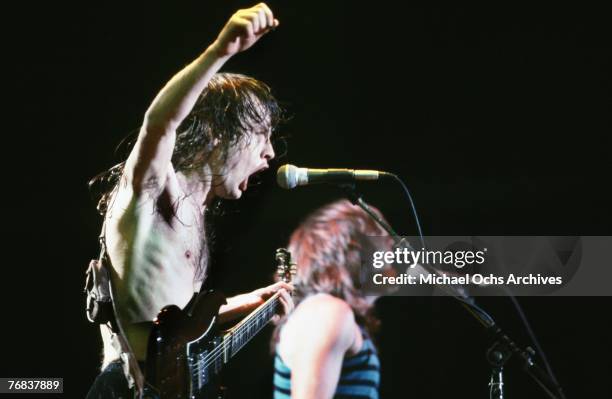 Guitarist Angus Young and bassist Cliff Williams of AC/DC sing backup during a concert on October 18 at the Forum in Inglewood, California.