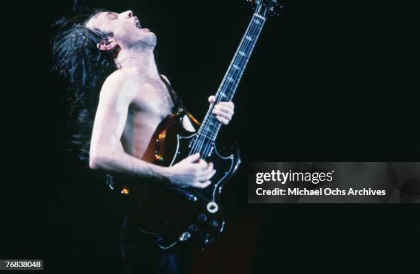 Guitarist Angus Young of AC/DC plays with manic energy during a concert on October 18 at the Forum in Inglewood, California.