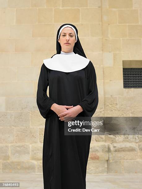 portrait of nun clasping hands looking into camera, alicante, spain, - religieuse photos et images de collection