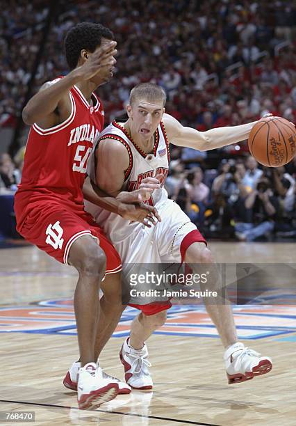 Steve Blake of the University of Maryland Terrapins attempts to dribble around Jeff Newton of the Indiana Univesity Hoosiers during the men's NCAA...