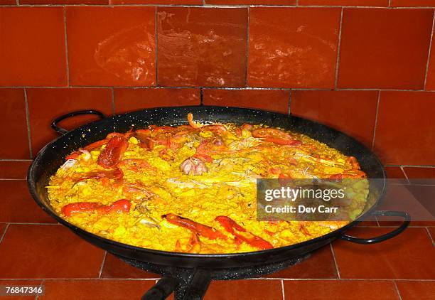 seafood paella in large pan, close-up - paella alicante stock pictures, royalty-free photos & images