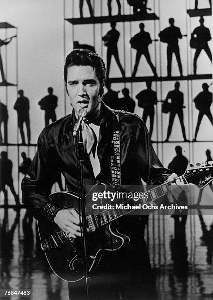 Rock and roll musician Elvis Presley performing Rock and roll musician Elvis Presley performing