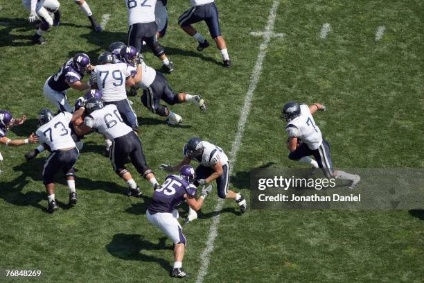 Luke Lippincott of the Nevada Wolf Pack carries the ball against the Northwestern Wildcats on September 8, 2007 at Ryan Field at Northwestern...