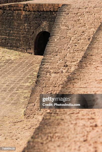 old ruins of a fort, fort aguada, goa, india - goa fort stock pictures, royalty-free photos & images