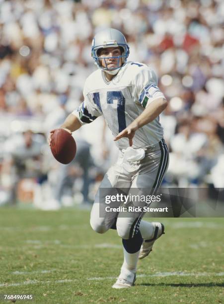 Dave Krieg, Quarterback for the Seattle Seahawks prepares to throw during the American Football Conference West game against the Los Angeles Raiders...