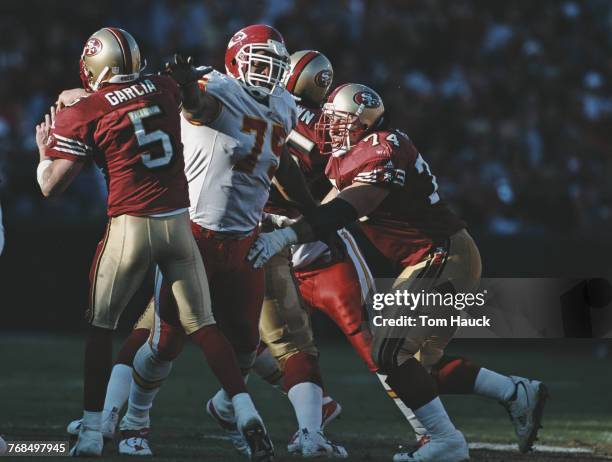 Chester McGlockton, Defensive End for the Kansas City Chiefs attempts to sack Jeff Garcia Quarterback for the San Francisco 49ers during their...