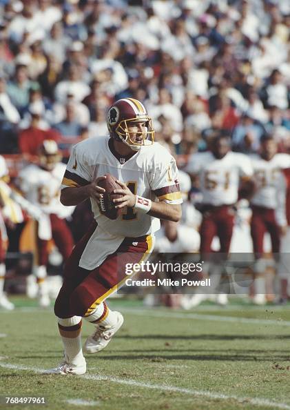 Mark Rypien, Quarterback for the Washington Redskins runs the ball ...