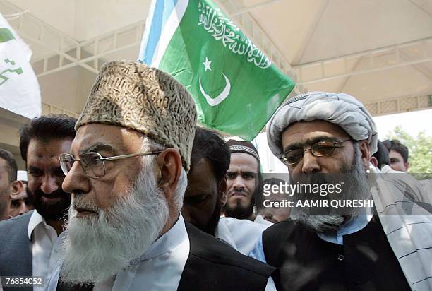 Qazi Hussain Ahmed , the chief of Pakistan's Islamist fundamentalist party Jamaat-e-Islami and Hafiz Hussain Ahmed leave the Supreme Court in...