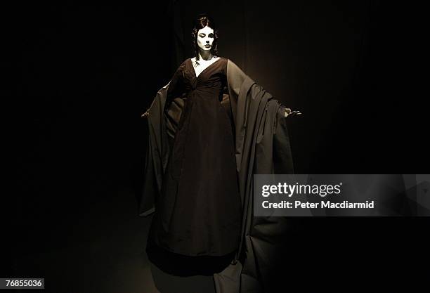 Mannequin wearing a Dior outfit 'Musique de Nuit' recreates a black and white photograph by Richard Avedon used in Harper's Bazaar magazine from 1956...