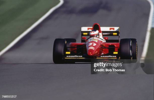 French racing driver Jean Alesi drives the Scuderia Ferrari Ferrari F93A Ferrari V12 in the 1993 European Grand Prix at Donington Park Circuit in...