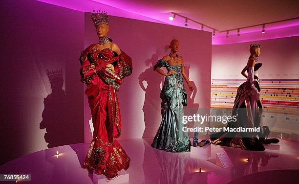 Mannequins wearing outfits by British designer John Galliano are displayed at The Golden Age of Couture Exhibition at The V&A Museumon September 19,...