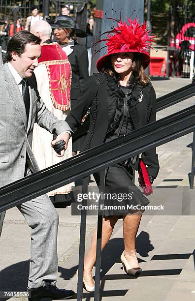 Joan Collins and husband Percy Gibson attend the Isabella Blow Memorial Service at Guards Chapel on September 18, 2007 in London, England.