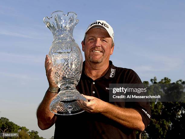 Mark Calcavecchia holds the winner's trophy during the final round of the PODS Championship at Innisbrook Resort and Golf Club in Palm Harbor,...