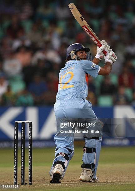 Yuvraj Singh of India hits a six during one over from Stuart Broad of England in which he hit six consecutive sixes to reach his half century in a...