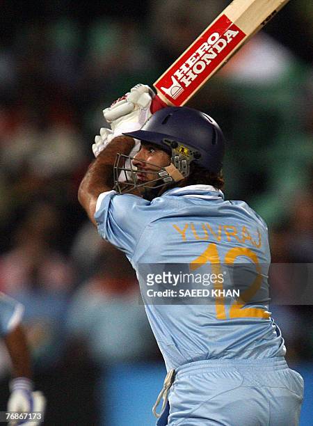 Indian cricket team player Yuvraj Singh plays a shot for six runs off England's pacer Stuart Broad in the ICC World Twenty20 match at the Kingsmead...