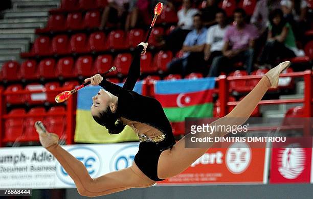 Anna Bessonova from Ukraine performs with the clubs during the 28th Rhythmic Gymnastics World Championships in Patras, 19 September 2007. AFP...