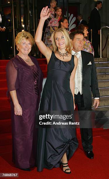 Stefanie Hertel with her parents Eberhard Hertel and Elisabeth Hertel attend the Goldene Henne award at the Friedrichstadtpalast on September 19,...