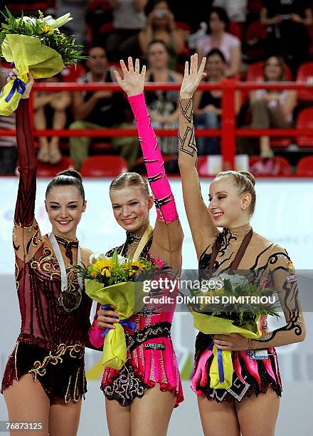 Gold medalist Olga Kapraova from Russia poses with silver medalist Anna Bessonova from Ukraine and bronze medalist Vera Sessina from Russia during...