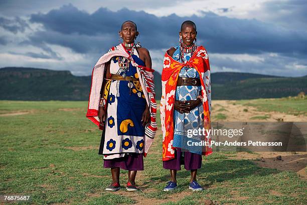 Unidentified Masai women dressed in traditional clothing along Lake Elementeita on December 12, 2006 close to Soysambu farm, Kenya. The 55,000-acre...