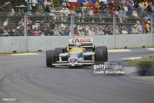 British Formula One racing driver Nigel Mansell, driving a Williams-Honda in the 1986 Australian Grand Prix at the Adelaide Street Circuit in...