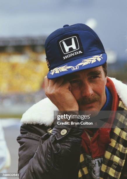 British Formula One racing driver Nigel Mansell, of the Williams-Honda team, in the pit lane before the start of the 1986 Australian Grand Prix at...