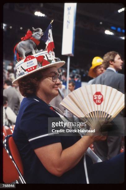 Republican supporter holds a fan at the Republican National Convention July 21, 1980 in Detroit, MI. Ronald Reagan and George Bush were chosen as the...